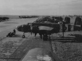 WW2_ - Rows of B-25 bombers being loaded with bombs 