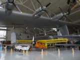 EAM_029 - Curtiss Robin B is dwarfed by the Spruce Goose
